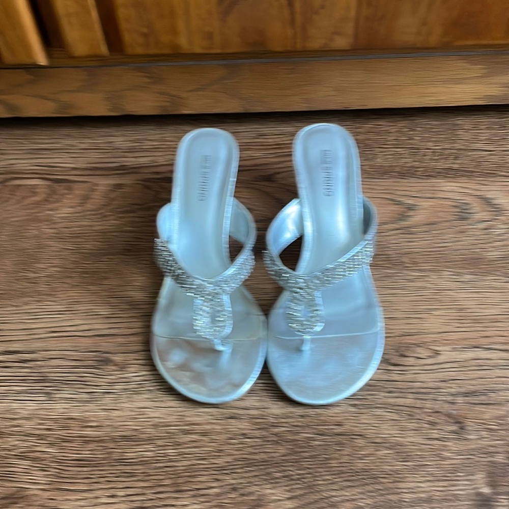 Ladies size 6.5 wedge silver sandal.